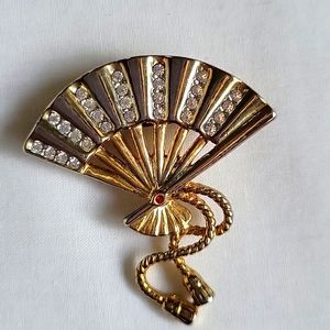 Vintage Fan pin with white stones and red stone.
